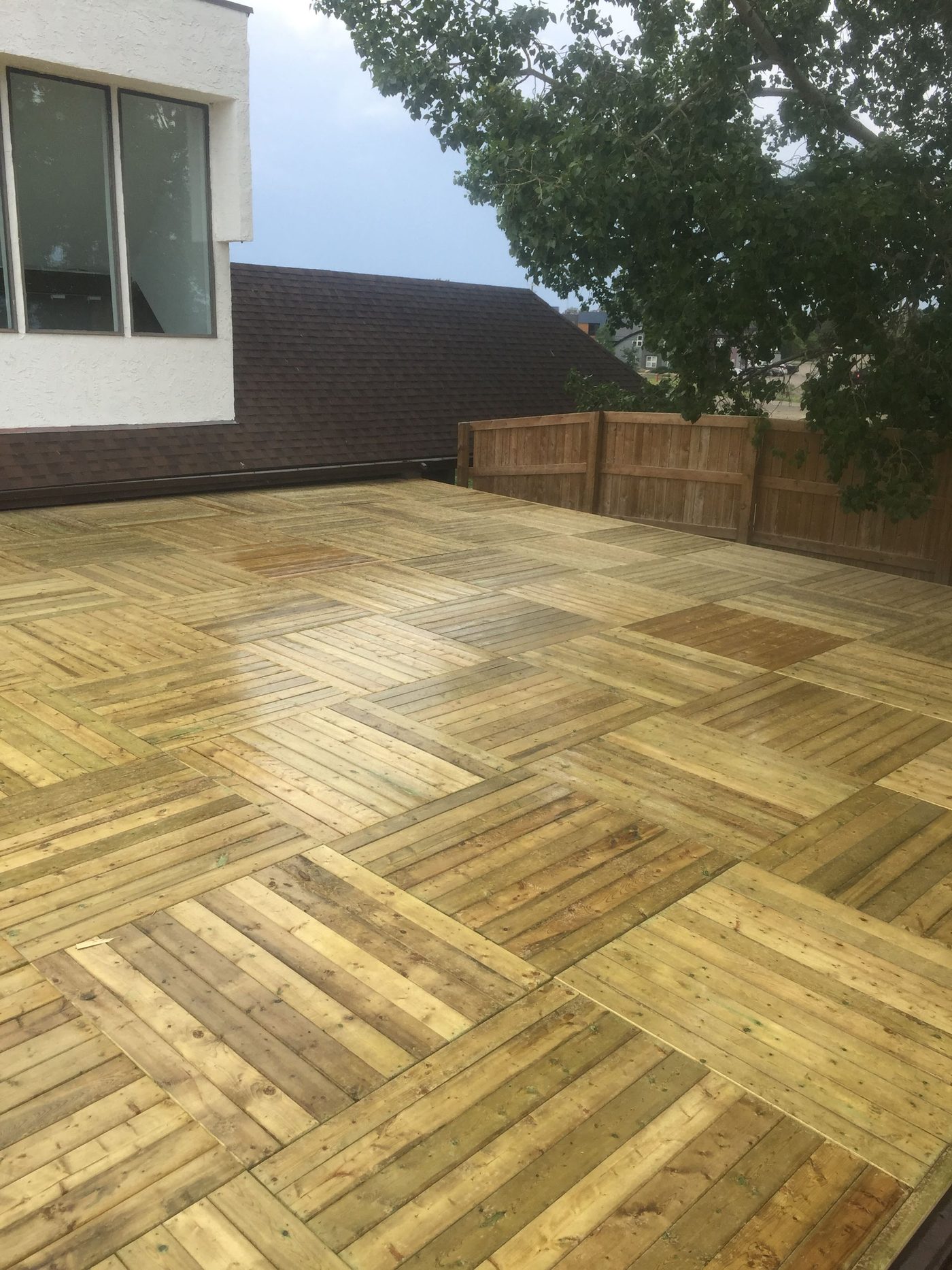 Freshly built wooden deck surface in a backyard