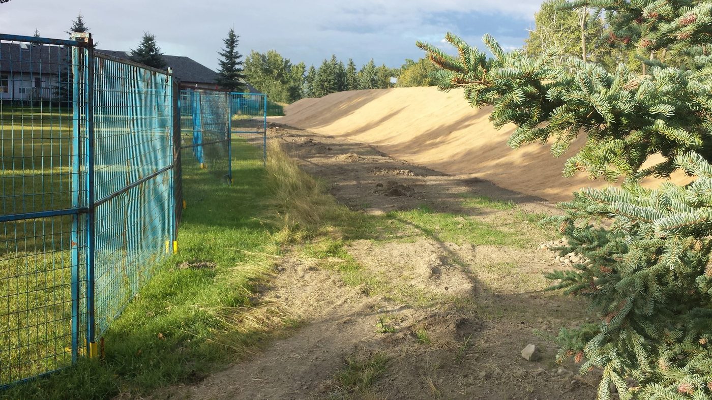 Chain link fence installed along a property line